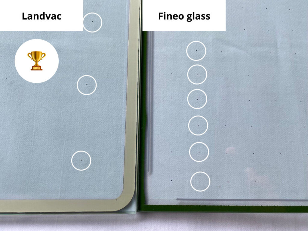 A comparison of two glass types: LandVac vs Fineo glass. The left side showcases "Landvac" with a trophy icon, while the right highlights "Fineo glass," both adorned with circular markers on a flat surface.