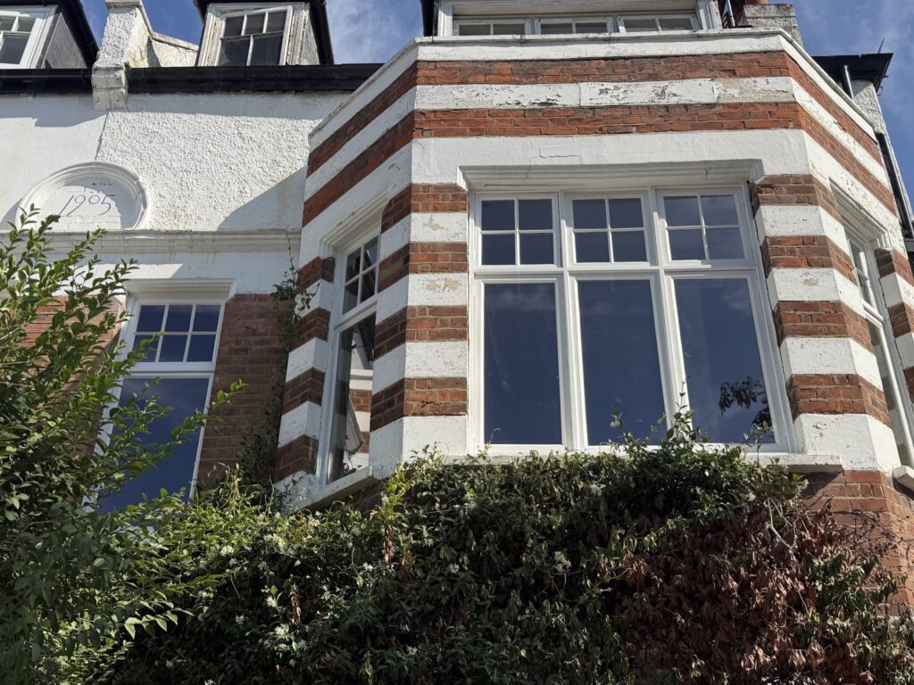 Sash window reglazing and repair in Chiswick: two Edwardian casement bays and the rear sashes, W4