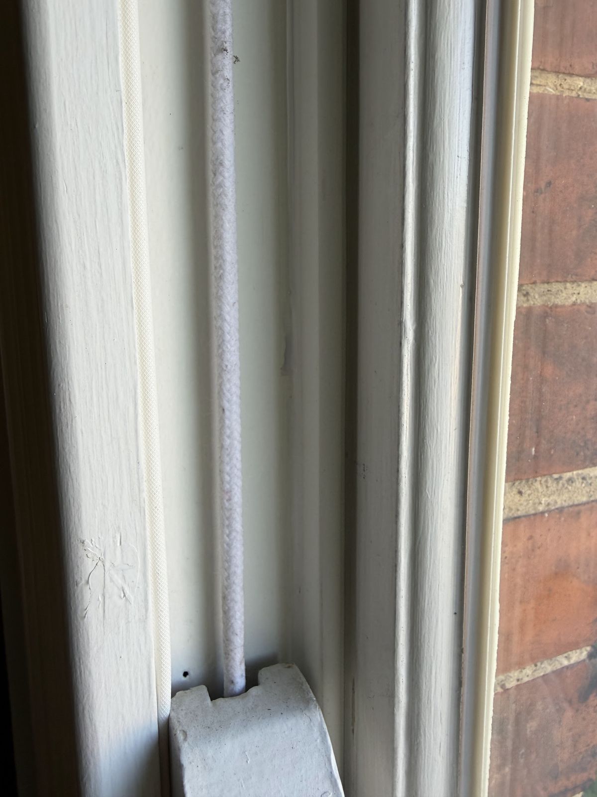 New timber staff bead with a concealed brush-pile seal fitted beside a new sash cord on a restored sash window